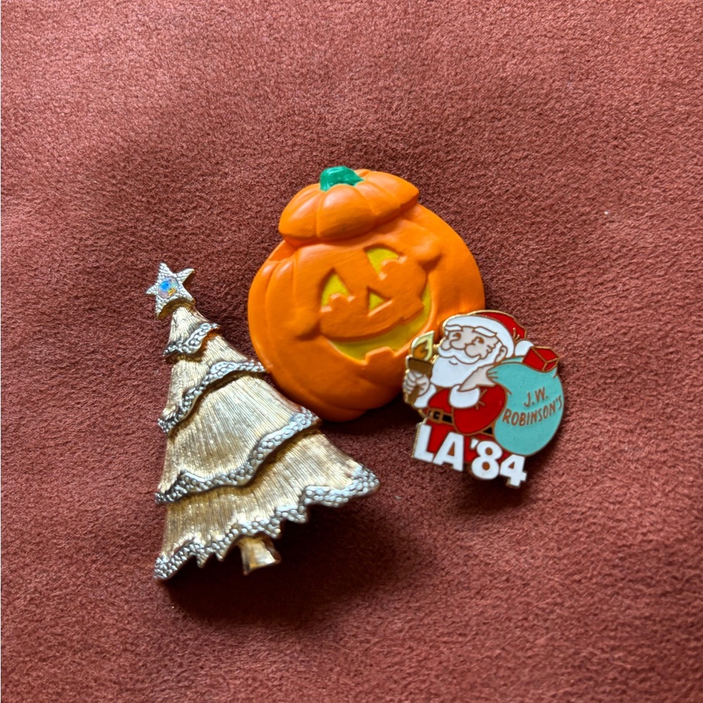 Three miscellaneous holliday brooches
